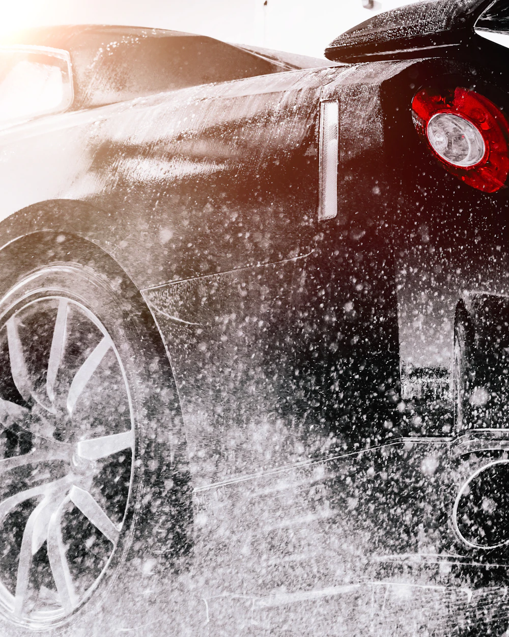 Black car in a detailing studio